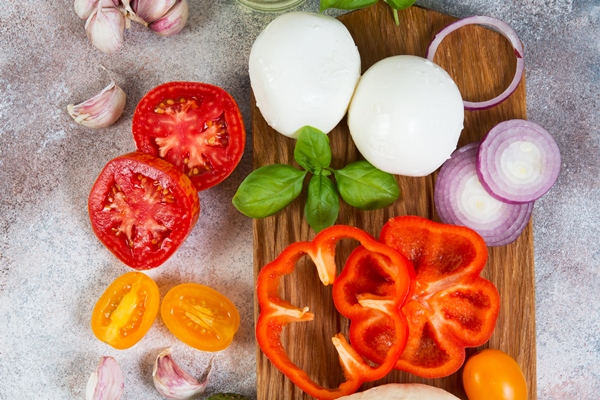 fresh pizza products lie on a concrete background vertical photo with copy space top view - Венгерское лечо