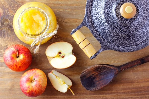 homemade apple sauce or apple puree in glass bowl over rustic wooden table top view - Майонез домашний «Яблочный»