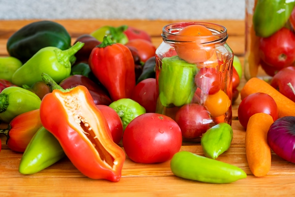 vegetables sweet peppers paprika tomatoes carrots onions ingredients for lecho the national dish of hungarian cuisine prepared for preservation in a glass jar - Венгерское лечо