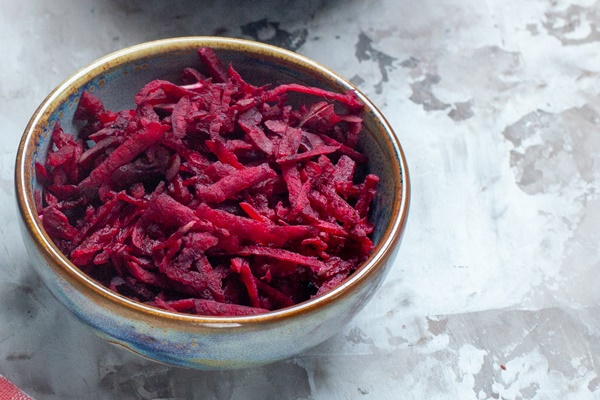 front view delicious borsch ukrainian beet soup inside plate on a white table - Борщевая заправка на зиму