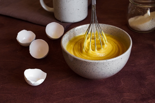 the process of making the cake bowl with dough for the pie and whisk - Кулич пасхальный