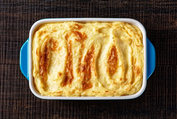 Постная запеканка с картошкой и грибами baked mashed potatoes with parmesan cheese and butter in a baking dish on dark wooden table horizontal view from above flat lay close up - Постная запеканка с картошкой и грибами