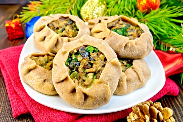 carols with mushrooms on napkin with christmas toys - Фарш из солёных грибов