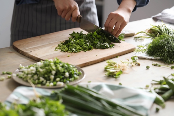 cooking chef is cutting greens in the kitchen 1 - Начинка для пирога со свежими грибами