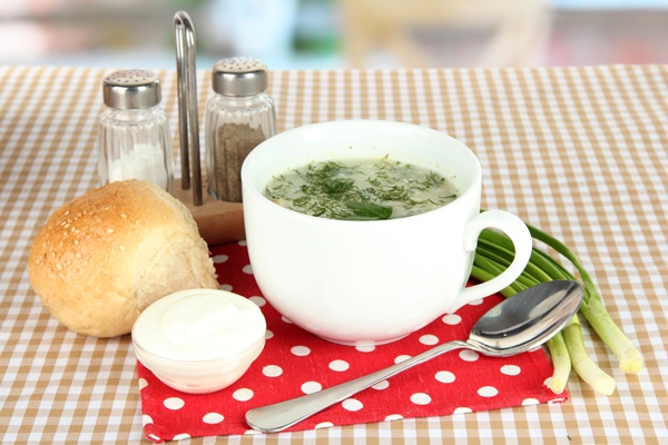 fragrant soup in cup on table in kitchen - Суп из сныти со свежими огурцами