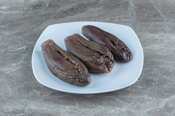 homemade pickled eggplant filled eggplant on white plate 1 - Баклажаны фаршированные (по-румынски), постный стол