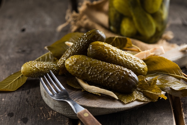 pickles canned fermented pickled cucumbers on wooden background homemade sour marinated vegetables - Винегрет с белой фасолью