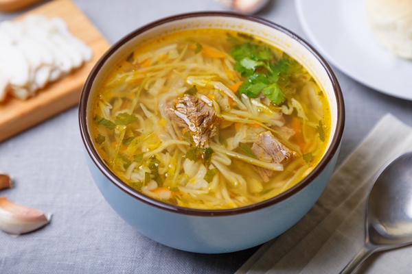 shchi with pampushki buns and lard soup of cabbage potatoes and meat traditional russian and ukrainian cuisine closeup - Суп с корневищами иван-чая