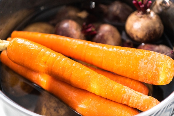 boiling vegetables in a big cooking pot to make a vinaigrette salad - Винегрет