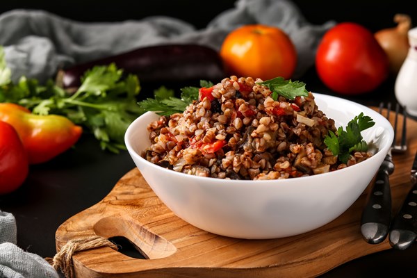 Гречневая каша с баклажаном healthy buckwheat cooked with vegetables in a white bowl - Гречневая каша с баклажаном