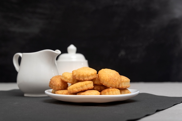 homemade cookies on the plate creamer and sugar bowl in the background baking for tea delicious breakfast - Песочное печенье, постный стол