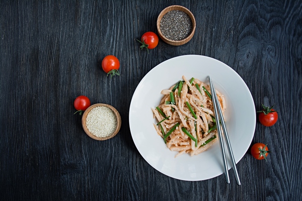 salad with daikon radish green onions honey and red chili powder asian salad flat lay dark 1 - Редька острая с мёдом
