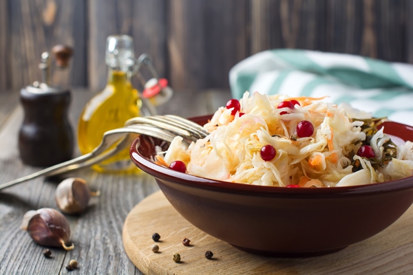 sour cabbage with cranberries in a ceramic plate on old wooden table rustic style selective focus - Капуста "провансаль"