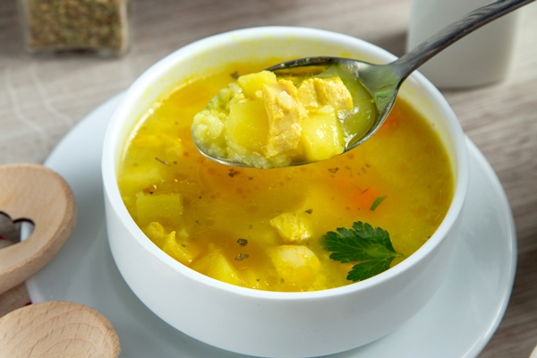 Суп картофельный с крупой и мясом chiken soup potato spices rice side view - Суп картофельный с крупой и мясом