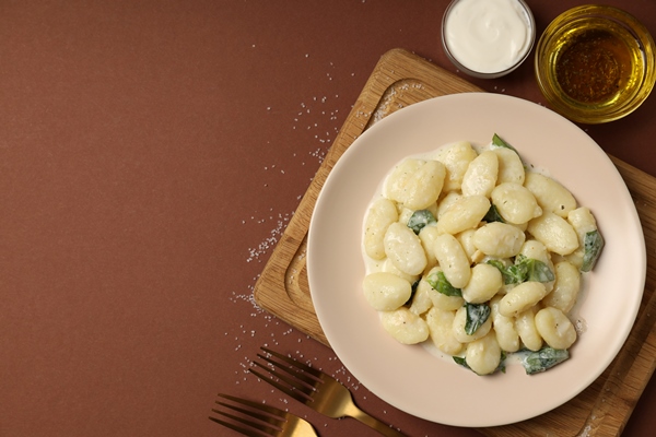 concept of tasty food with gnocchi space for - Клёцки из брынзы