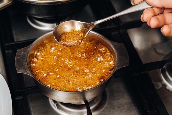 preparation of sugar candies at home a taste of our childhood rooster lollipops boiling sugar caramel - Карамельный соус