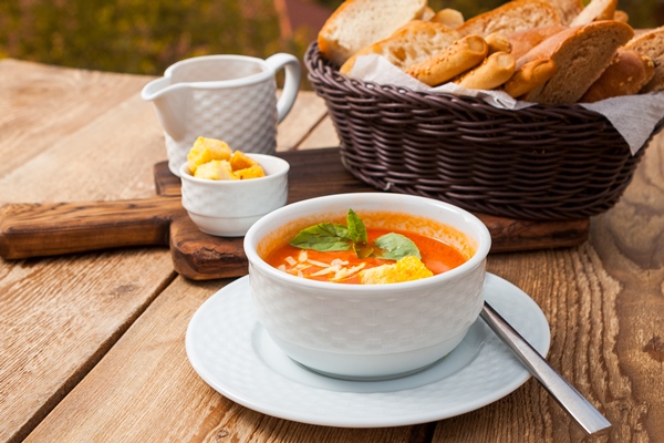 Сырный суп с копчёностями и молоком some delicious soup meal with bread in a bowl with forest on background high angle view - Сырный суп с копчёностями и молоком