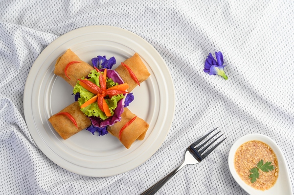 Блинчики с крабовыми палочками egg roll or fried spring rolls on the white plate thai food top view - Блинчики с крабовыми палочками