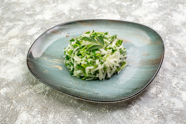 Постный салат с пророщенным машем front view delicious salad consists greens cabbage inside plate white surface - Постный салат с пророщенным машем