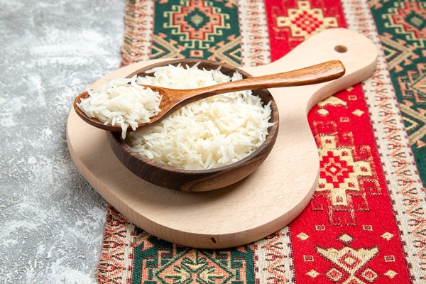 front view tasty cooked rice inside brown plate on white space - Монастырская кухня: суп из зелени и чинёная репа