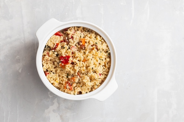 Пшённая каша с квашеной капустой по-монастырски tabbouleh on small white bowl on ceramic - Пшённая каша с квашеной капустой по-монастырски
