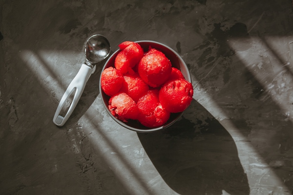 top view peeled tomatoes in bowl on textured table horizontal space for - Баклажаны, фаршированные грибами