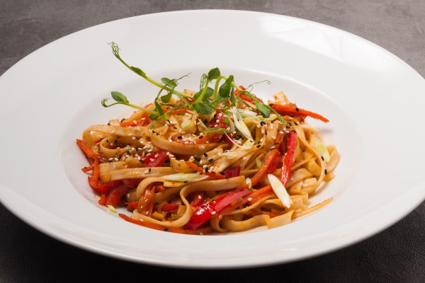 udon wheat noodles with vegetables sesame seeds and microgreens - Монастырская фасолевая лапша