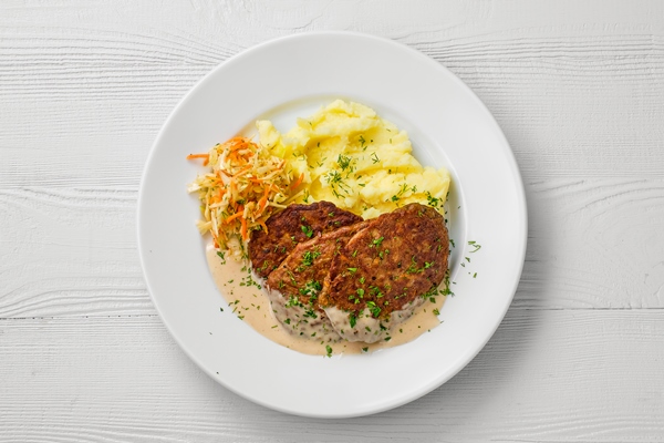 Особенности питания детей top view of plate with liver cutlet mashed potato and pickled cabbage - Особенности питания детей