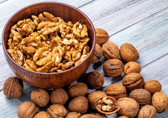 side view of a bowl with walnuts on rustic - Мутаки бакинские