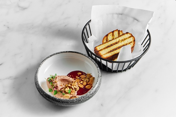 Ягодная холодная приправа restaurant pate with berry sauce peanuts and microgrin in a marble plate with toast in a metal basket on a white marble background - Ягодная холодная приправа