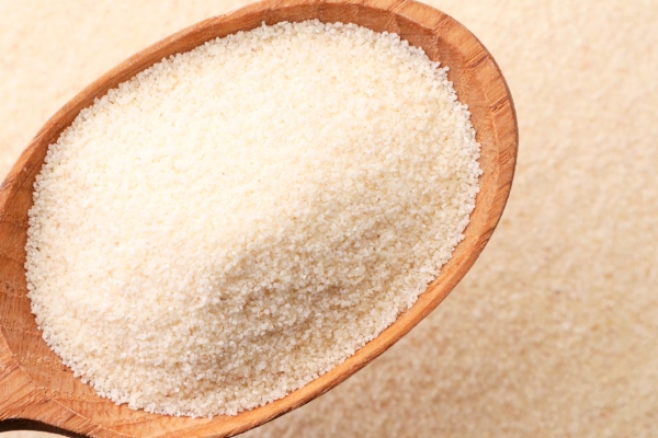 semolina in a wooden spoon close up on a background of cereals the view from top - Постная икра из нори