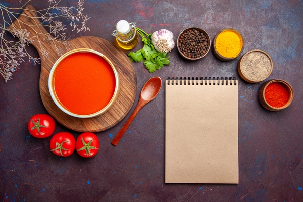 top view of tasty tomato soup with seasonings and fresh tomatoes on dark - Турецкая запеканка с кебабом