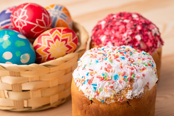 preparations celebrating easter composition easter breads easter eggs wooden table - Кулич с изюмом