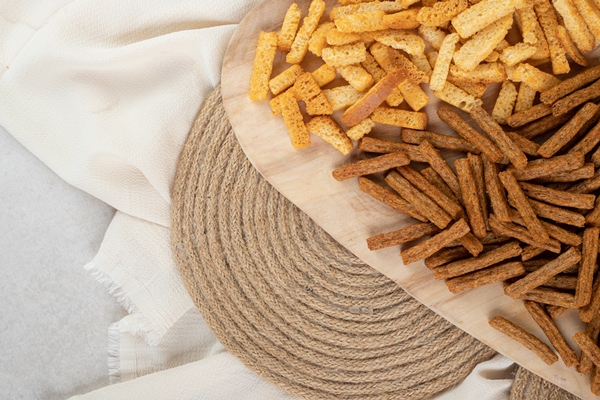 two types of crunchy crackers on wooden board - Тюря