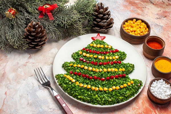 Постный салат с тунцом "Новогодний" front view tasty green salad in new year tree shape with seasonings on light background - Постный салат с тунцом "Новогодний"