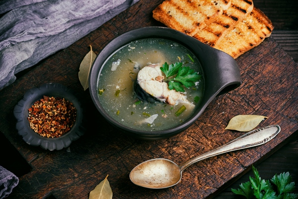fish soup with mackerel in a brown clay plate 1 - Поморская уха