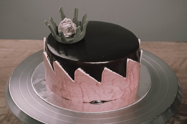 board with delicious cake on table - width=