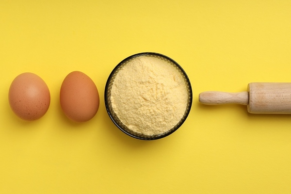 ingredients for pie or cake cooking on yellow background - title=