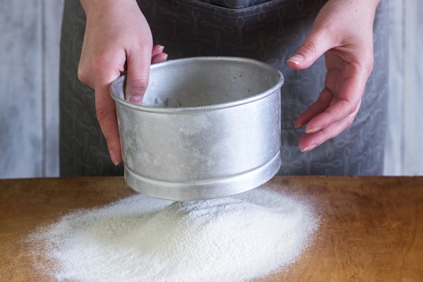 woman makes homemade noodles from flour eggs salt rustic style - Сырные вафли