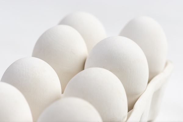white ceramic eggs box with white background macro photo food concept - Яйца-писанки