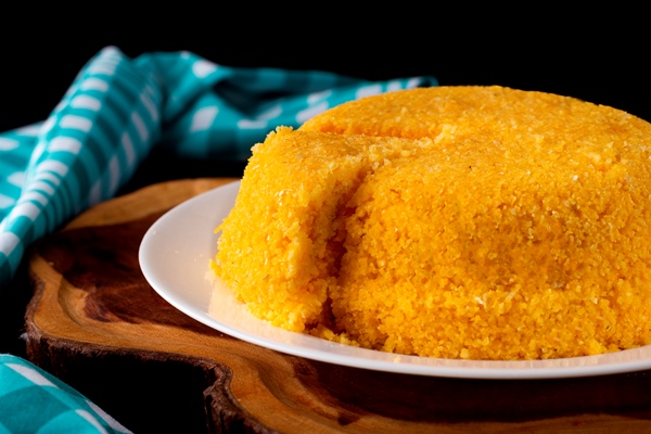 cuscuz with cheese typical northeastern food white plate - Мамалыга по-монастырски