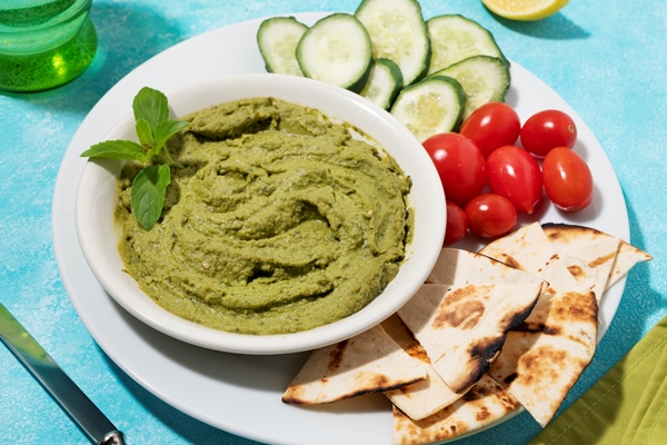 high angle hummus vegetables arrangement - Бутербродная ореховая паста по-афонски