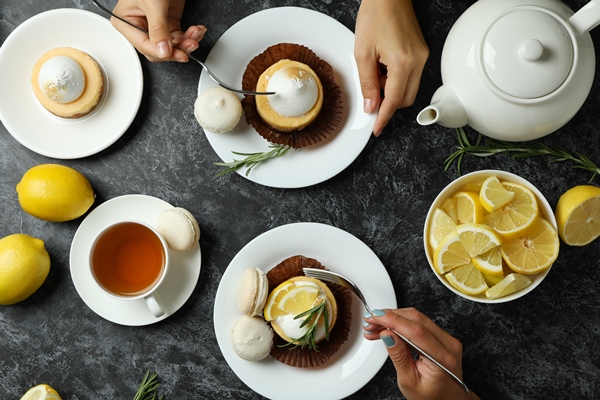 concept tasty breakfast with lemon cupcakes macaroons - Чай по-русски