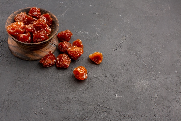 front view dried fruits grey space - Рябиновые цукаты