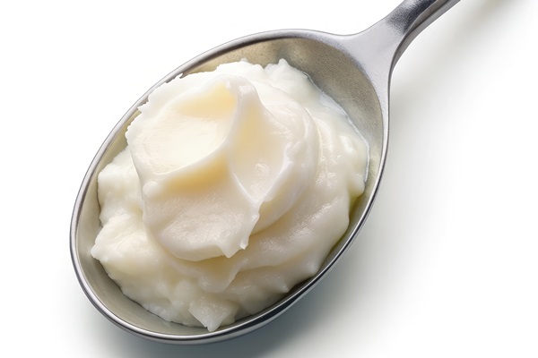 Смалец soft paraffin stainless steel spoon clean background generative ai 1 - Смалец