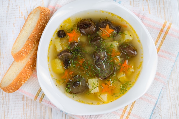 mushroom soup with honey agarics white plate - Постный картофельный суп с опятами