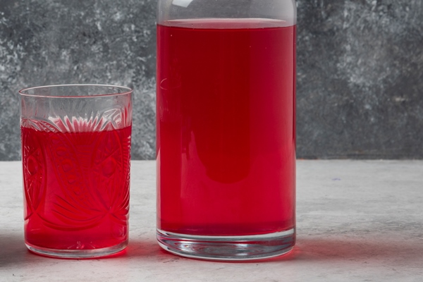 red cornel berries glass cup with juice aside - Компот из базилика