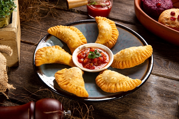 plate fried oriental patties chebureks - Посикунчики по-пермски