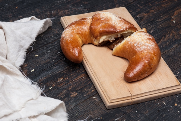 tasty croissant wooden surface - Домашние рогалики на сметане