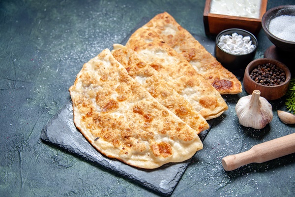 front view tasty gutabs thin hotcakes with pepper salt dark surface - Чебуреки из заварного теста